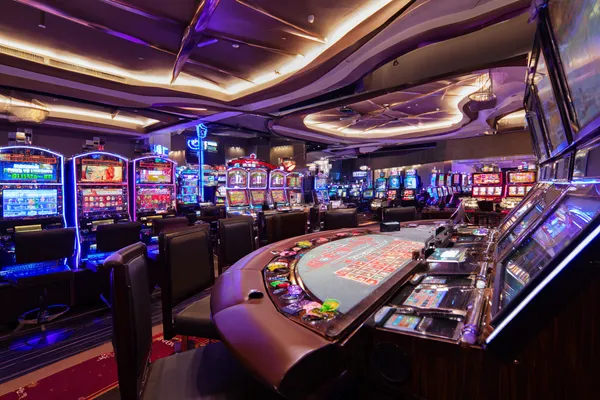 A glowing roulette wheel with cascading chips, symbolizing the engaging live and instant-win games available on JLWAFA88.