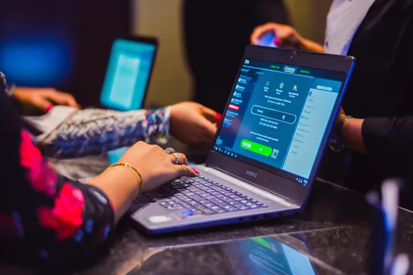 JLWAFA88 Login — Instantly access your secure account A confident dealer surrounded by casino chips inviting players to access their JLWAFA88 account, reflecting quick and easy login options.